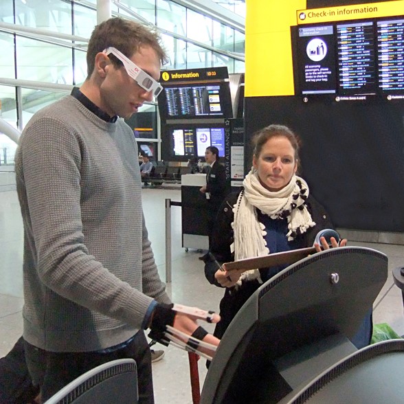 Two people wearing simulation gloves and glasses